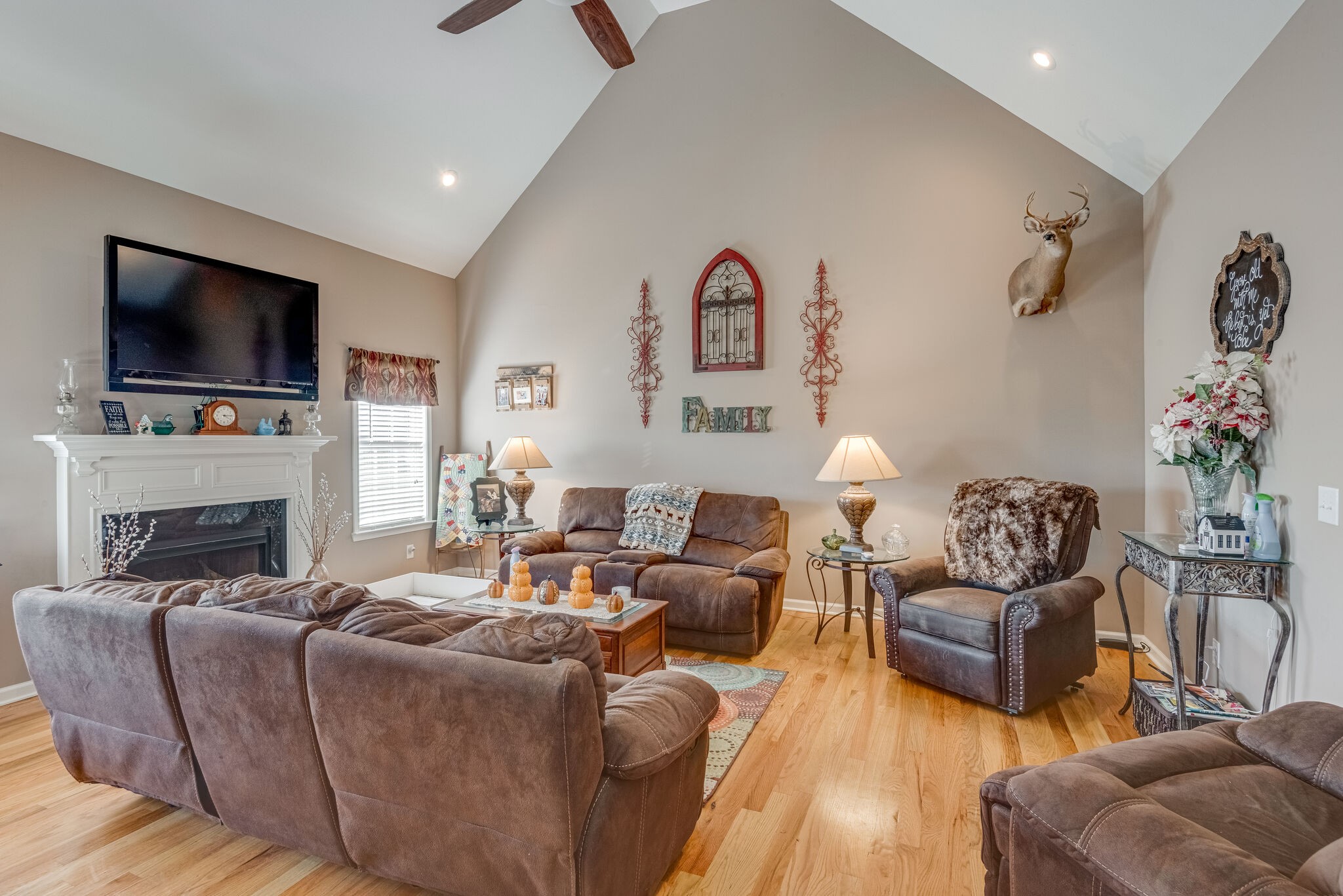 932 Goslin Branch Road Burns, TN 37029 - Photo 6 of 24 a living room with furniture a flat screen tv and a fireplace
