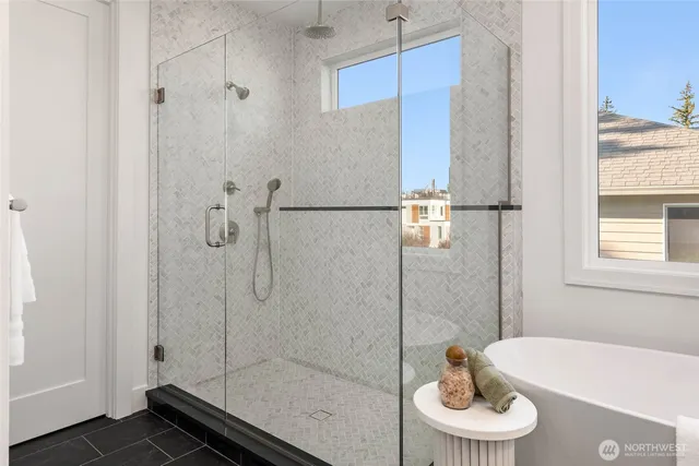 a bathroom with a sink a toilet and a shower