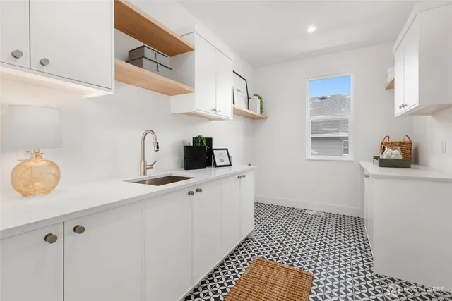 a kitchen with a sink and cabinets