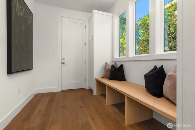 a view of room with window and wooden floor