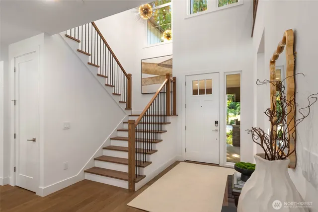a view of entryway with wooden floor and stairs