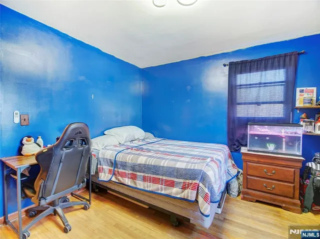 a bedroom with a bed and furniture