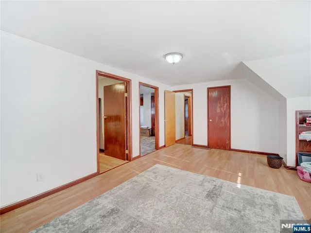 an empty room with closet area