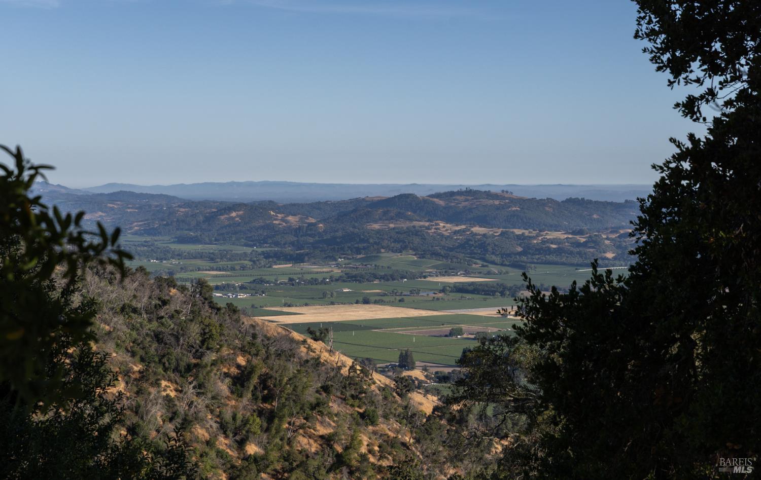 7051 Geysers Road Geyserville, CA 95441 - Photo 4 of 21 a view of lake with mountain and trees around