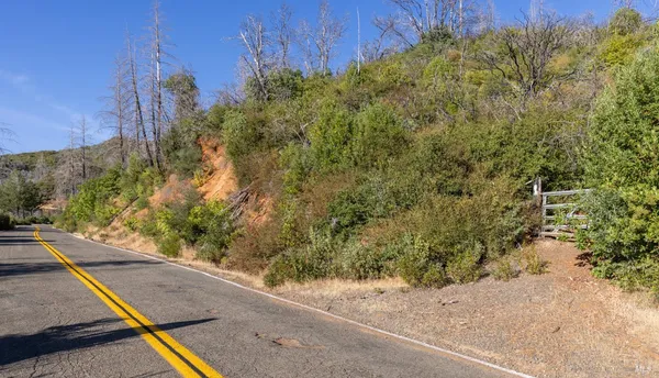 a view of balcony with wooden floor and fence