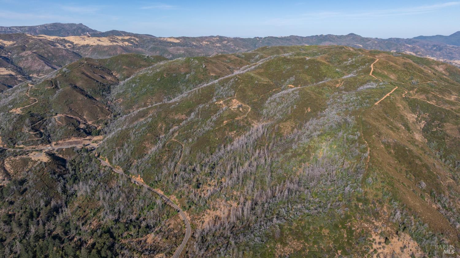 7051 Geysers Road Geyserville, CA 95441 - Photo 10 of 21 a view of a town with mountains in the background