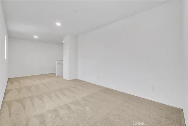 a view of an empty room and entryway