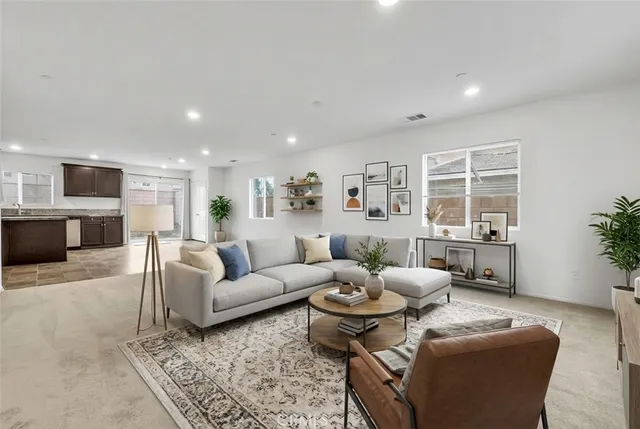 a view of an empty room with a window and fireplace