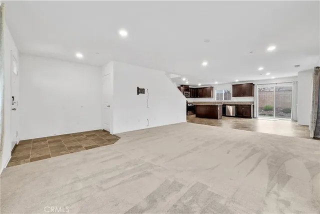 a kitchen with stainless steel appliances granite countertop a sink and stove