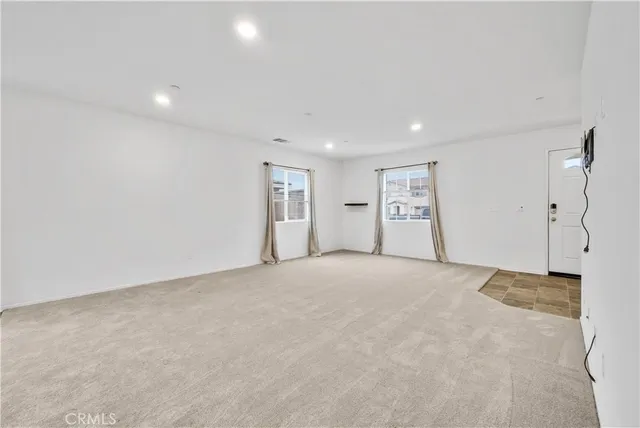 a kitchen with a stove sink and cabinets