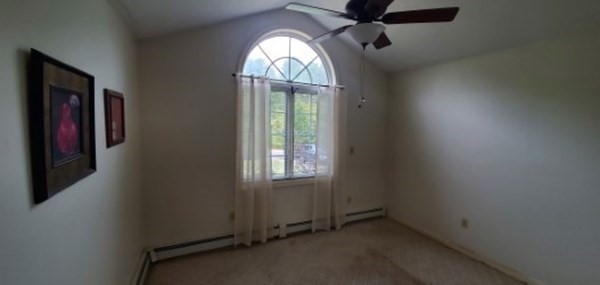 205 Reed Road Westport, MA 02790 - Photo 8 of 16 an empty room with windows and exposed bricks