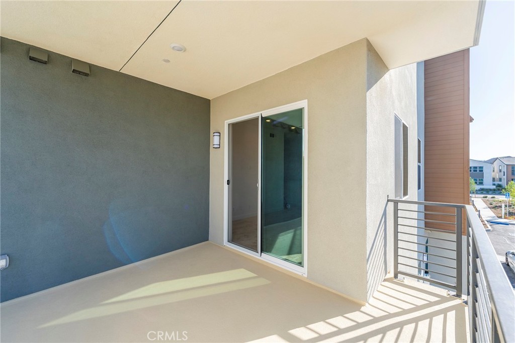 121 Baluster Irvine, CA 92618 - Photo 30 of 80 a view of a hallway with wooden floor and staircase