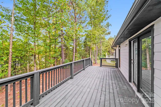a view of balcony with wooden floor