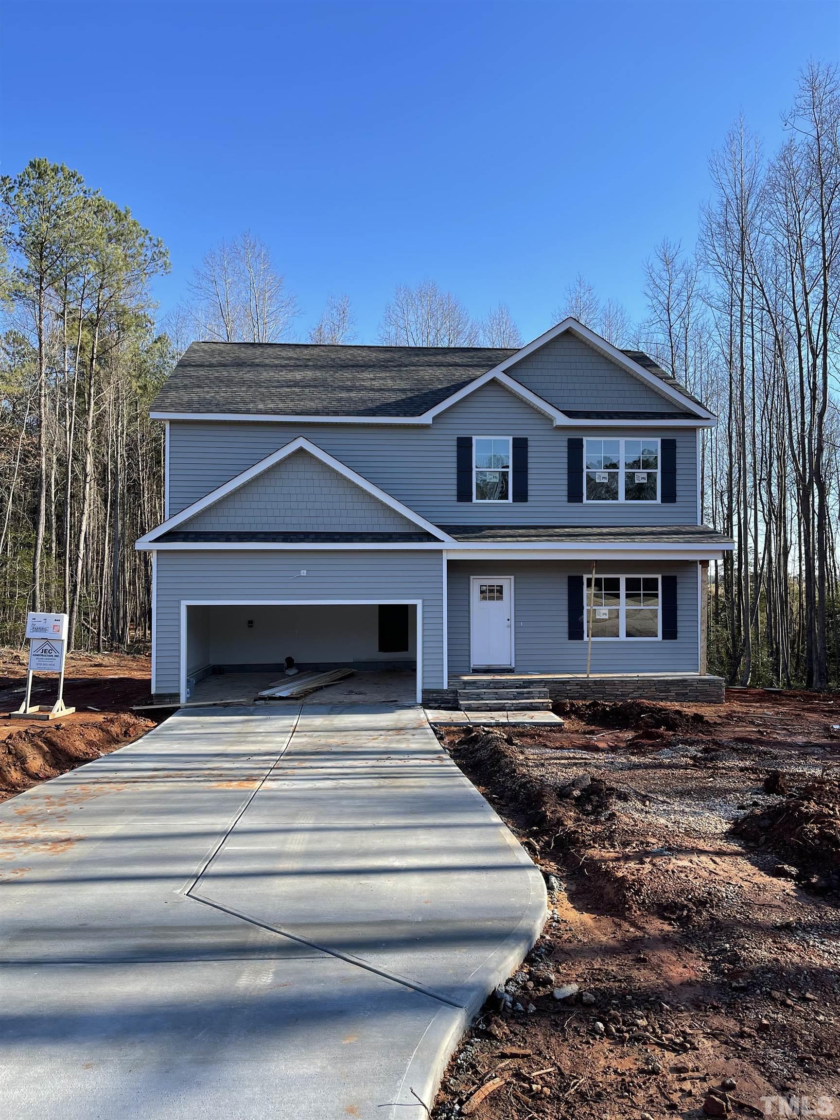 10667 West Old Spring Hope Road Spring Hope, NC 27882 - Photo 1 of 9 a view of a house with a yard
