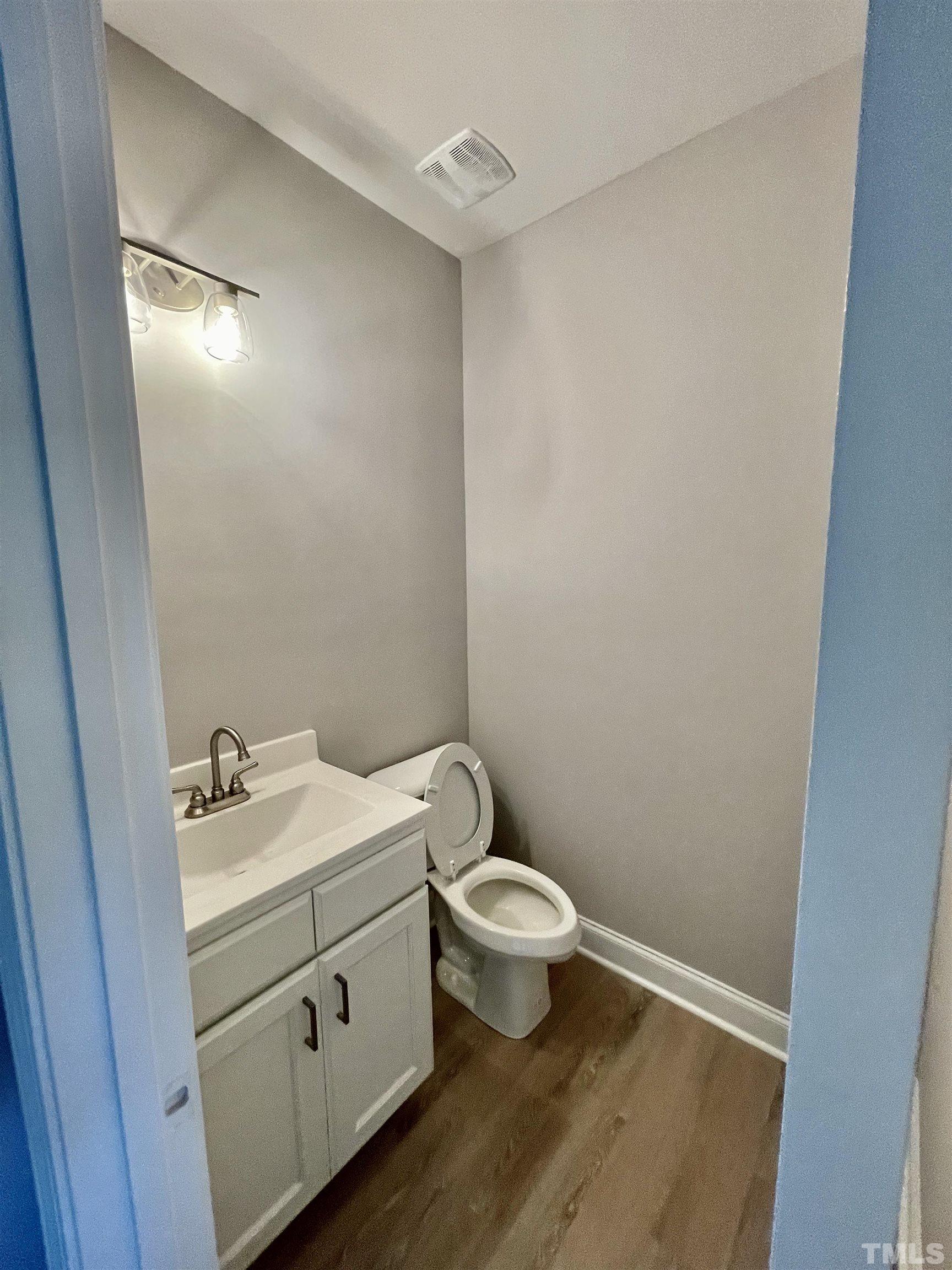 10667 West Old Spring Hope Road Spring Hope, NC 27882 - Photo 6 of 9 a bathroom with a sink toilet and vanity