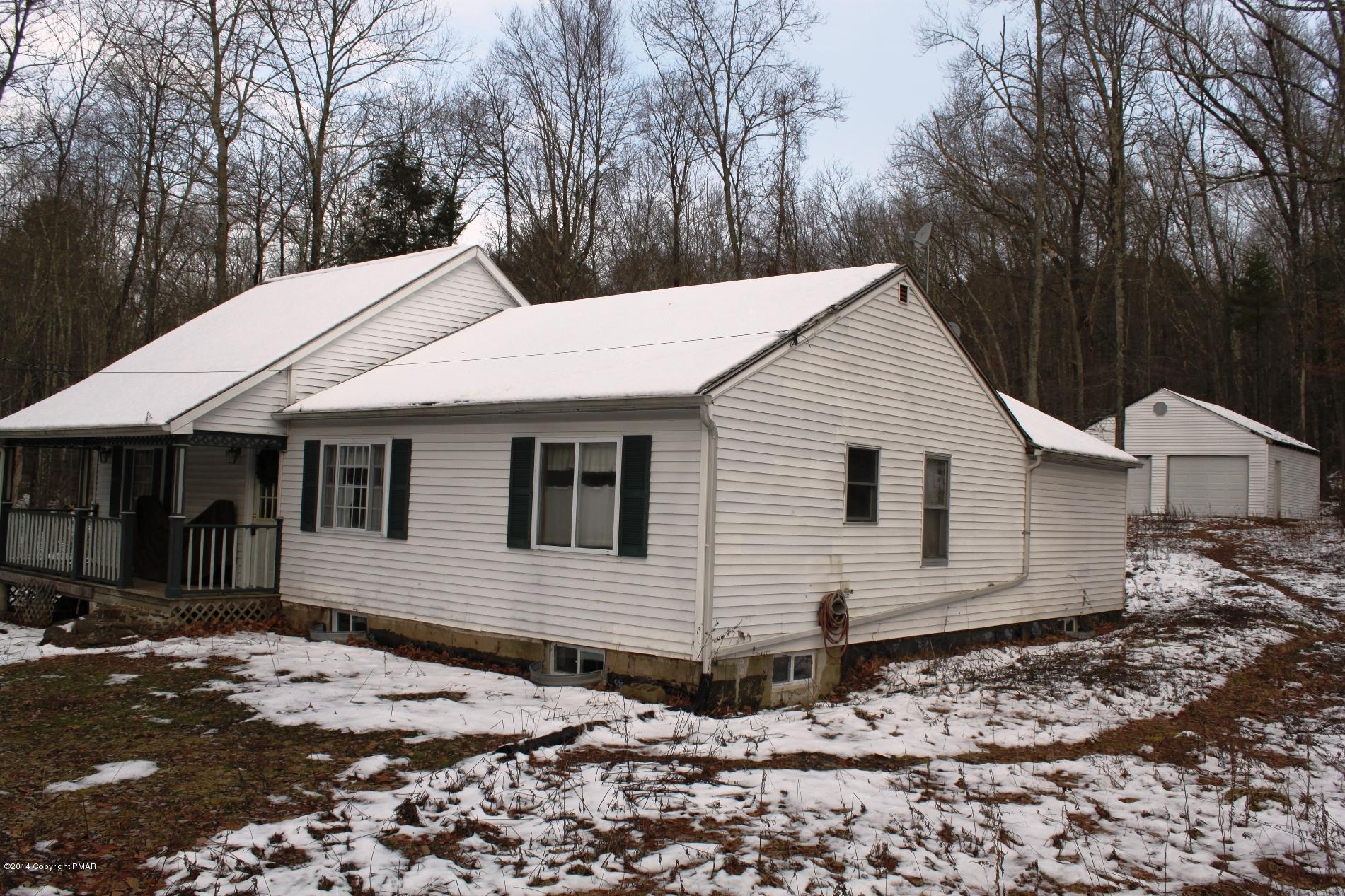 1055 Bush Road Cresco, PA 18326 - Photo 1 of 24 a view of a white house with a large tree next to a yard