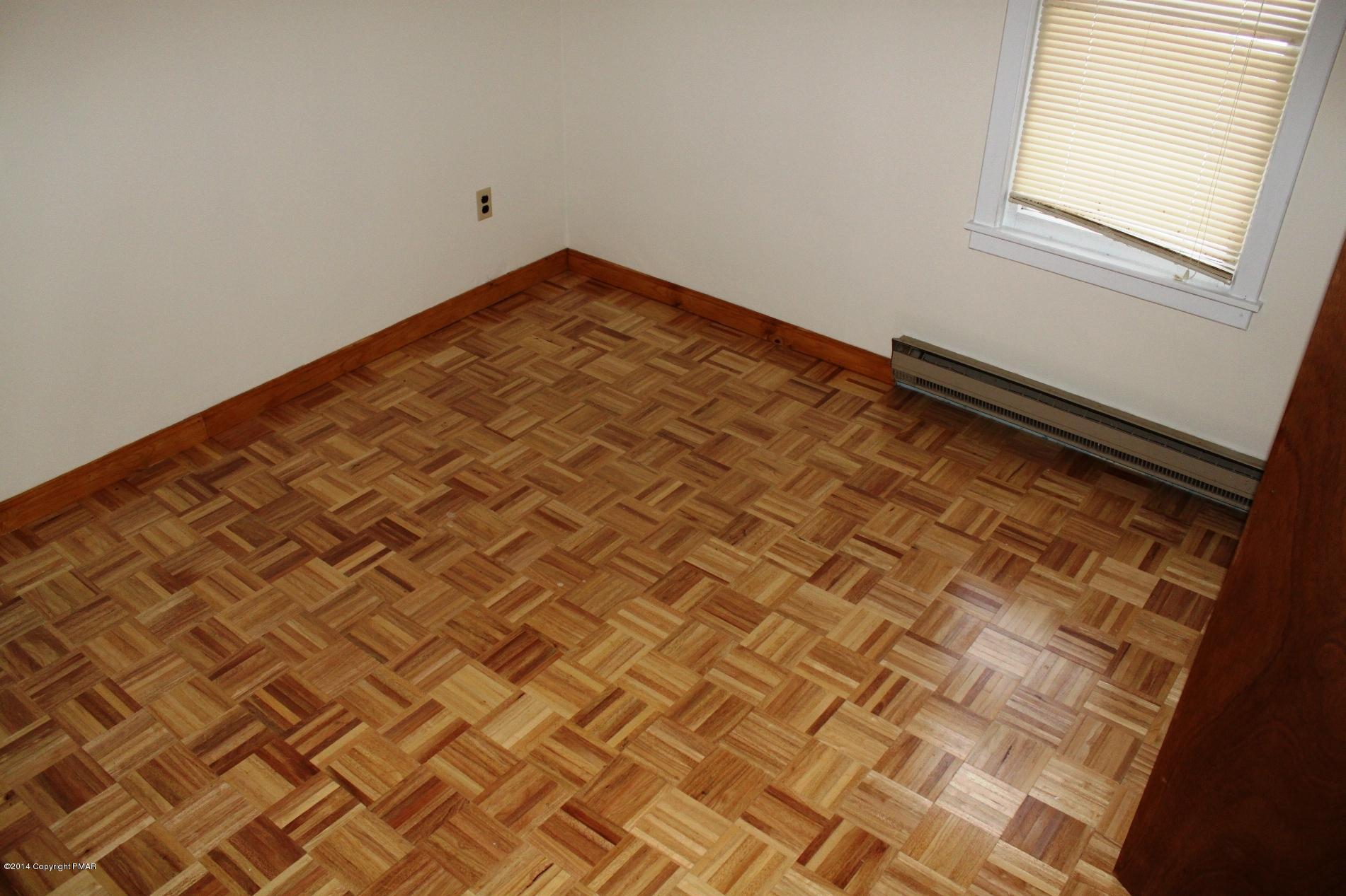 1055 Bush Road Cresco, PA 18326 - Photo 15 of 24 an empty room with a bed