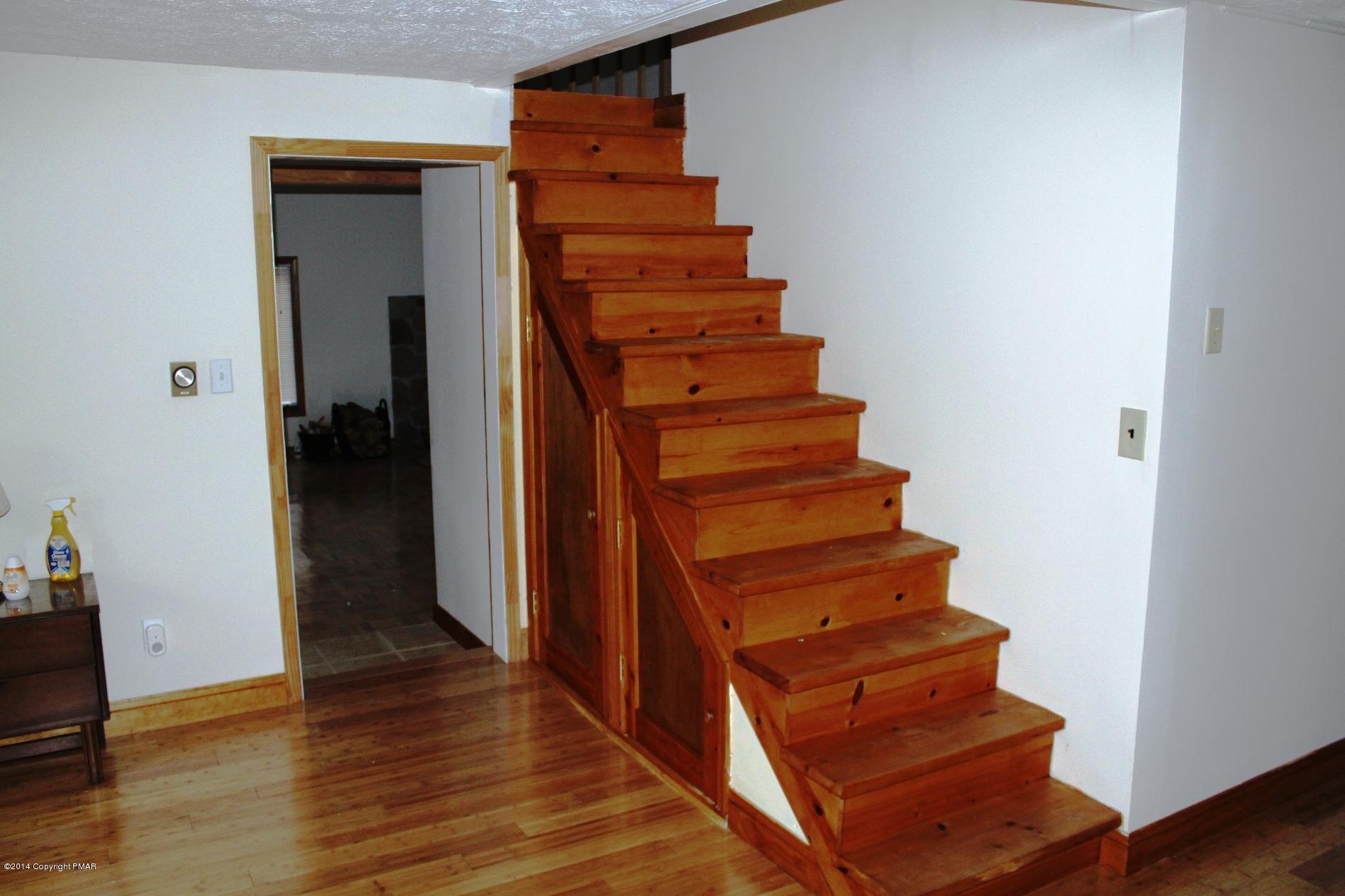 1055 Bush Road Cresco, PA 18326 - Photo 18 of 24 a view of a hallway with wooden floor and entryway