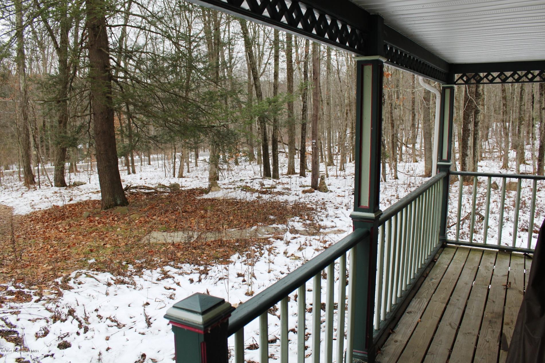 1055 Bush Road Cresco, PA 18326 - Photo 2 of 24 a view of a backyard with wooden fence