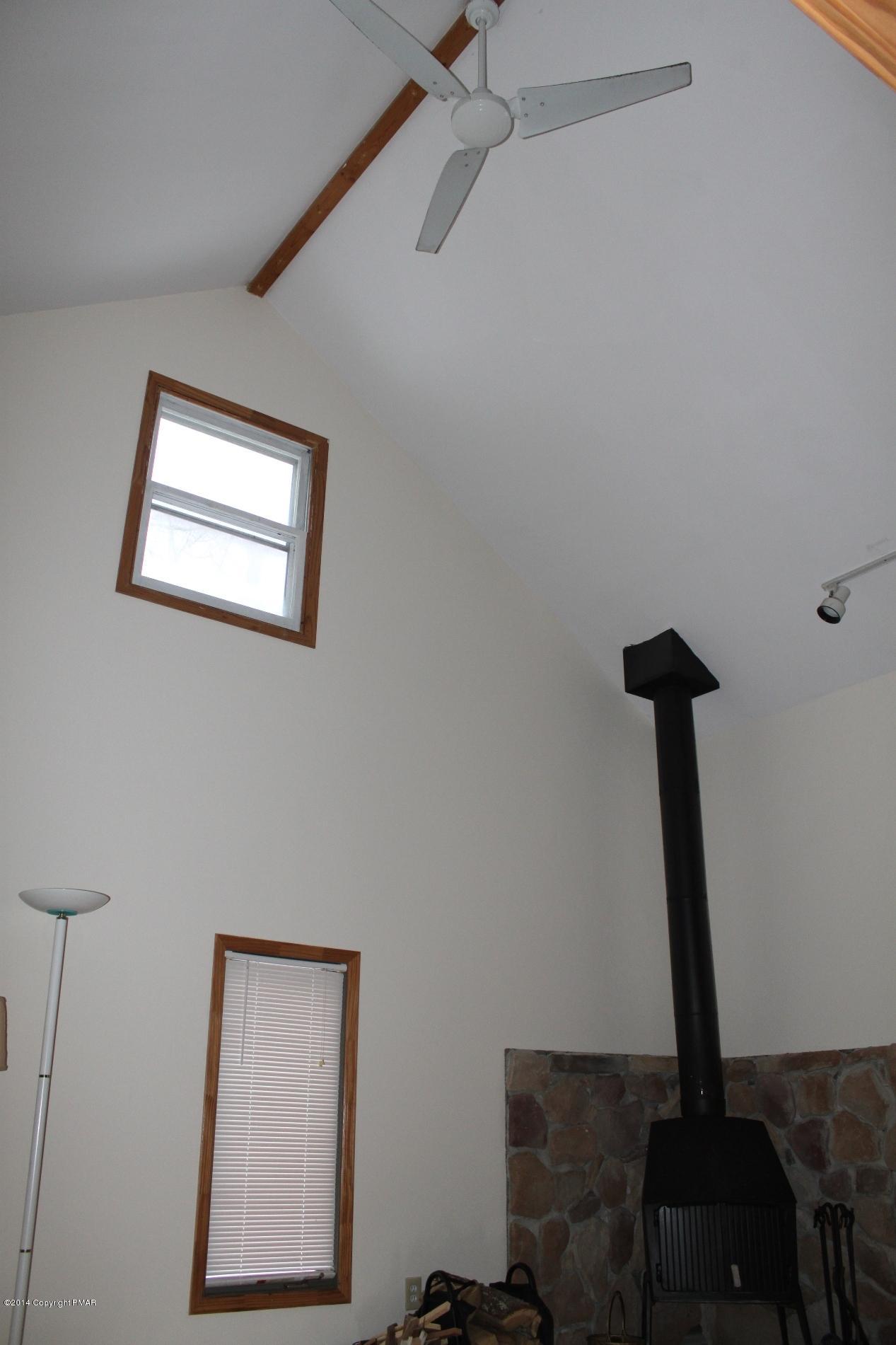 1055 Bush Road Cresco, PA 18326 - Photo 4 of 24 a view of hallway with a window and a potted plant