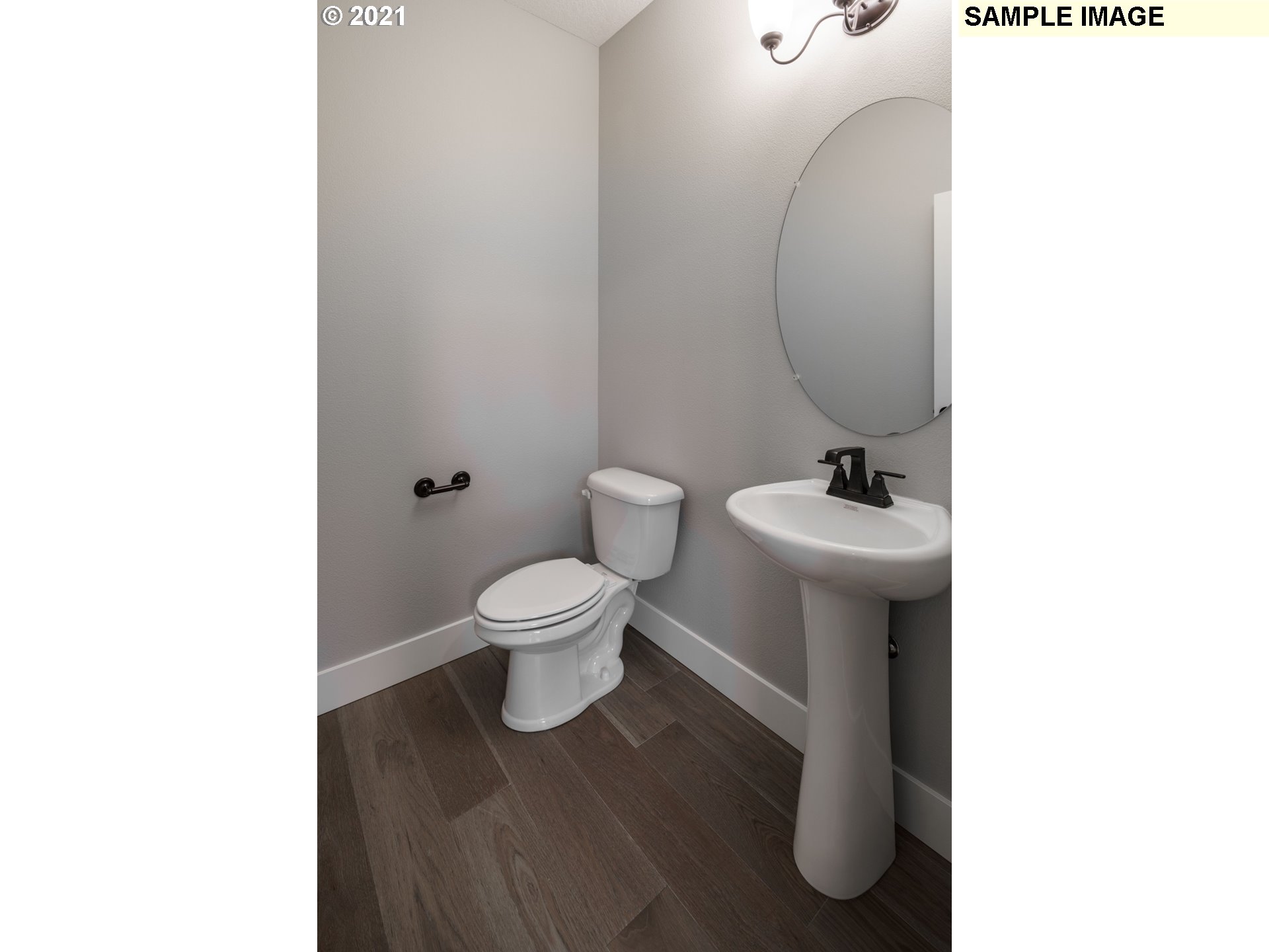 South Cherry Grove Way Ridgefield, WA 98642 - Photo 22 of 32 a bathroom with a toilet sink and mirror