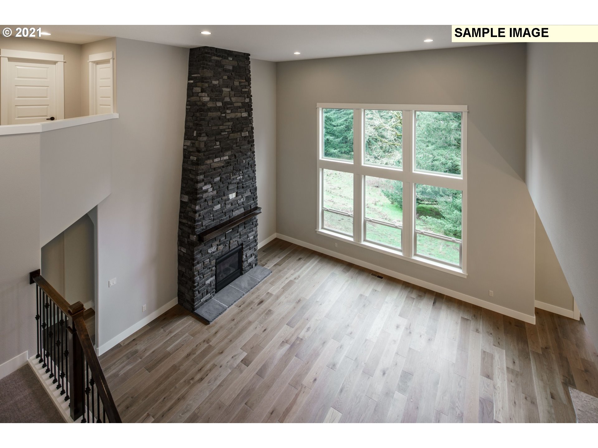 South Cherry Grove Way Ridgefield, WA 98642 - Photo 26 of 32 a view of an empty room with wooden floor and a window