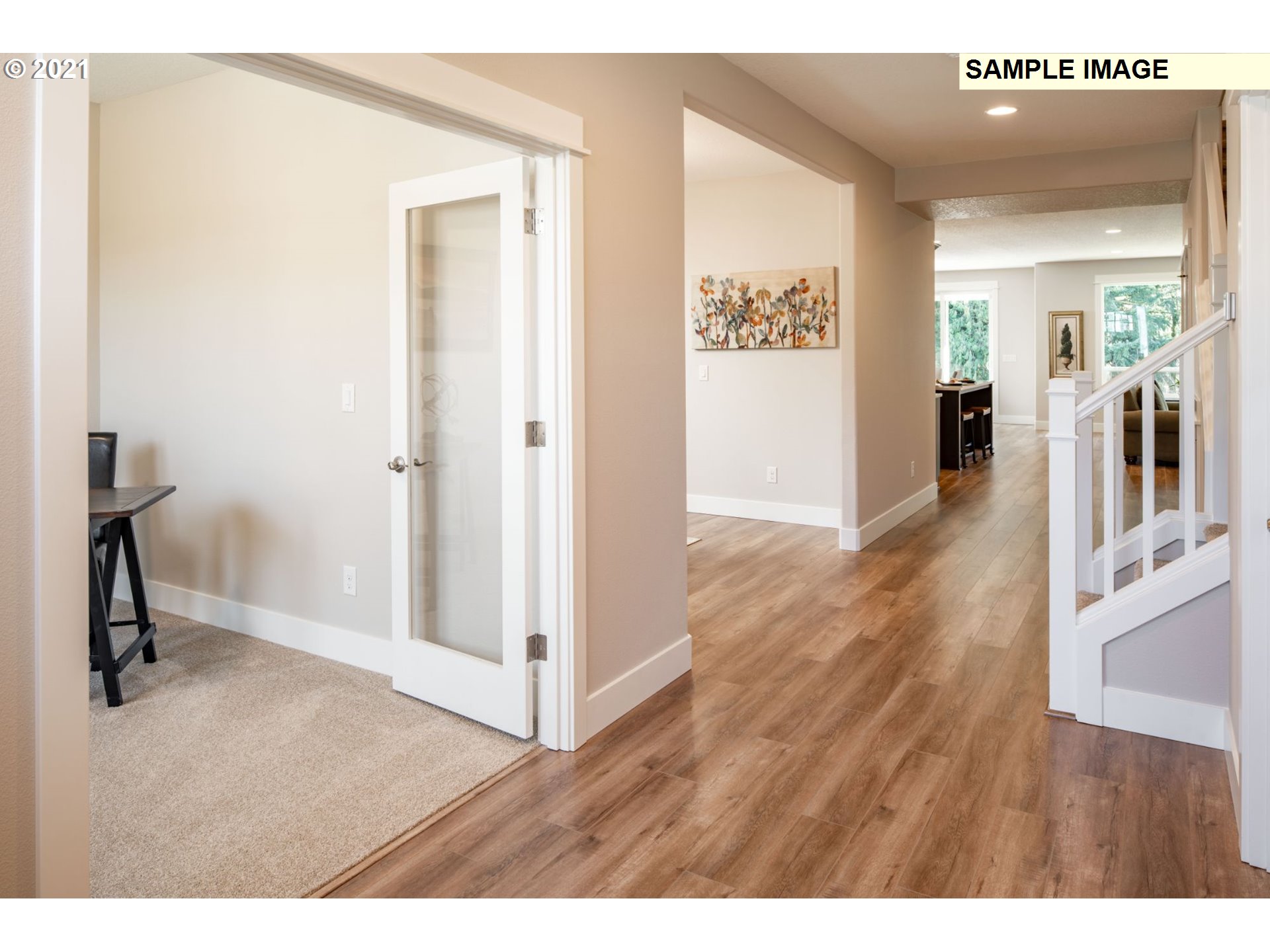 South Cherry Grove Way Ridgefield, WA 98642 - Photo 4 of 32 a view of a hallway view with wooden floor and living room