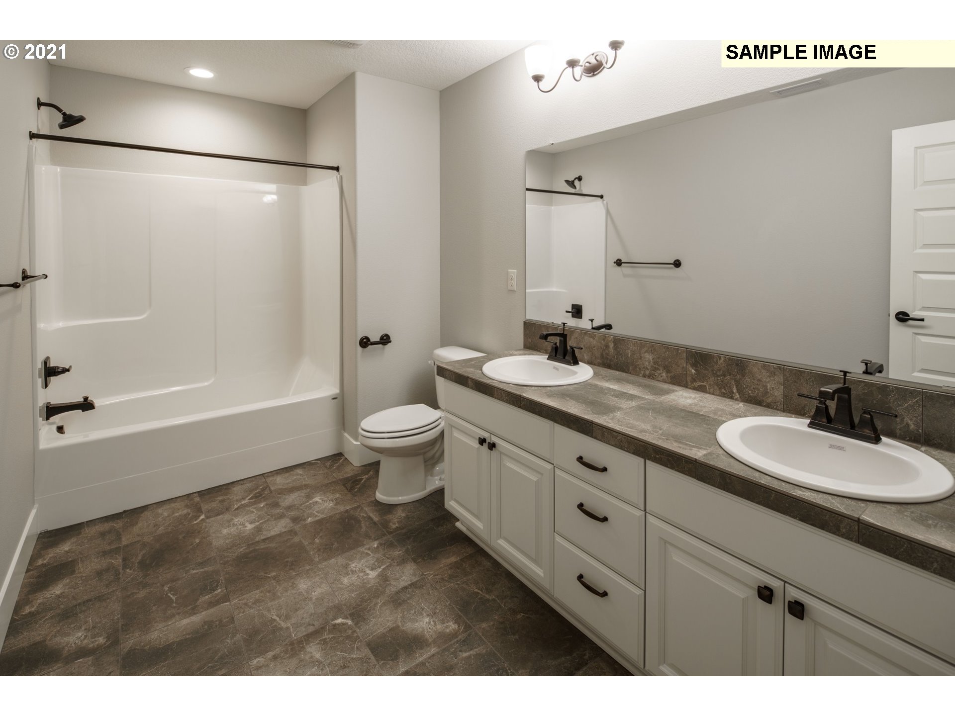 South Cherry Grove Way Ridgefield, WA 98642 - Photo 32 of 32 a bathroom with a double vanity sink toilet mirror and shower