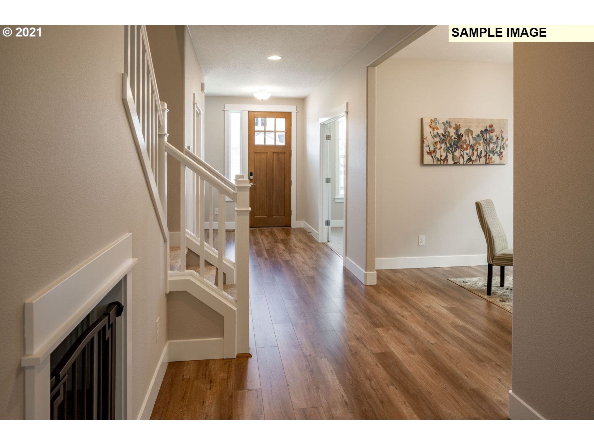 South Cherry Grove Way Ridgefield, WA 98642 - Photo 6 of 32 a view of a hallway with wooden floor and stairs