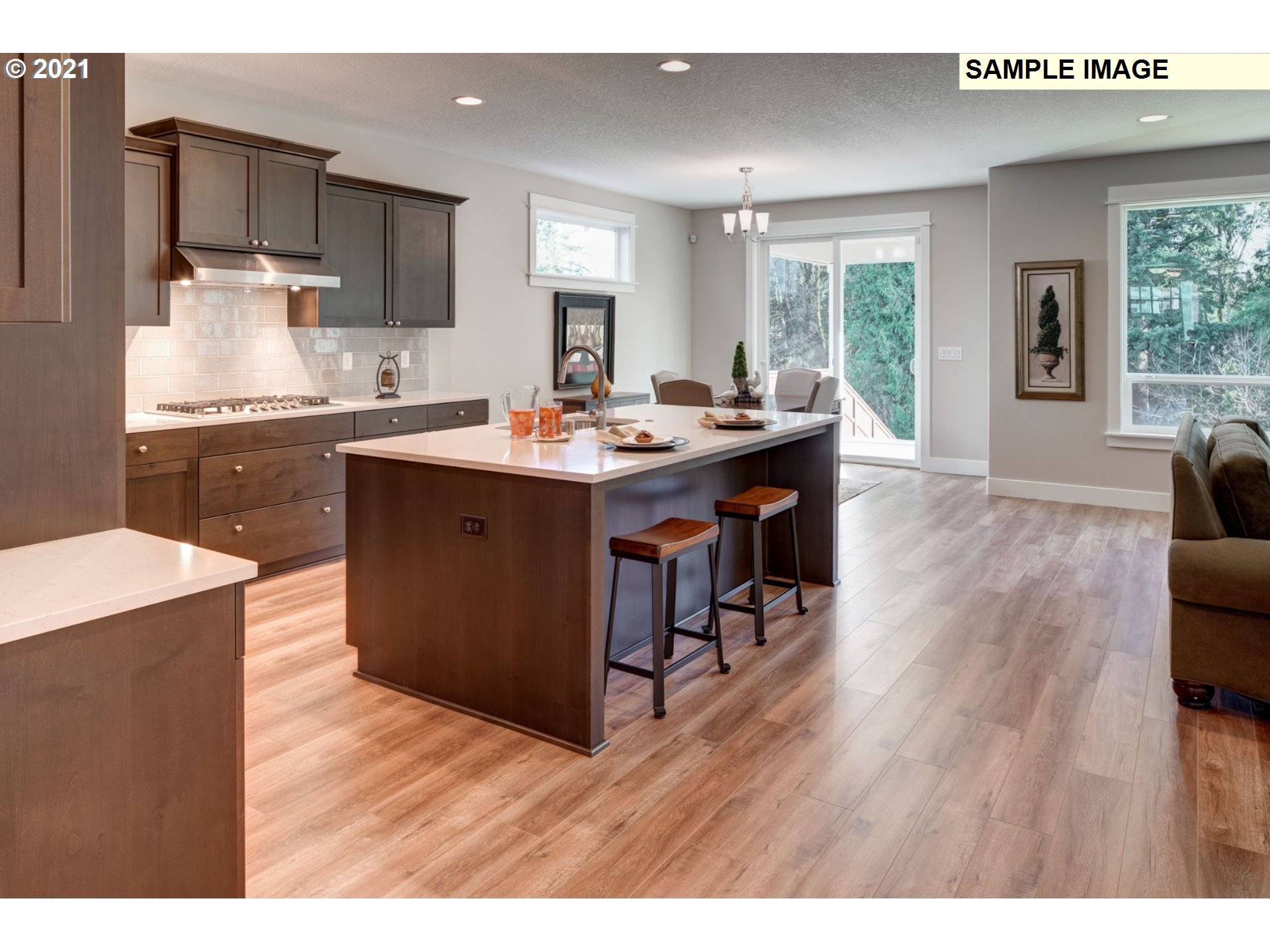 South Cherry Grove Way Ridgefield, WA 98642 - Photo 7 of 32 a kitchen with a sink cabinets and wooden floor