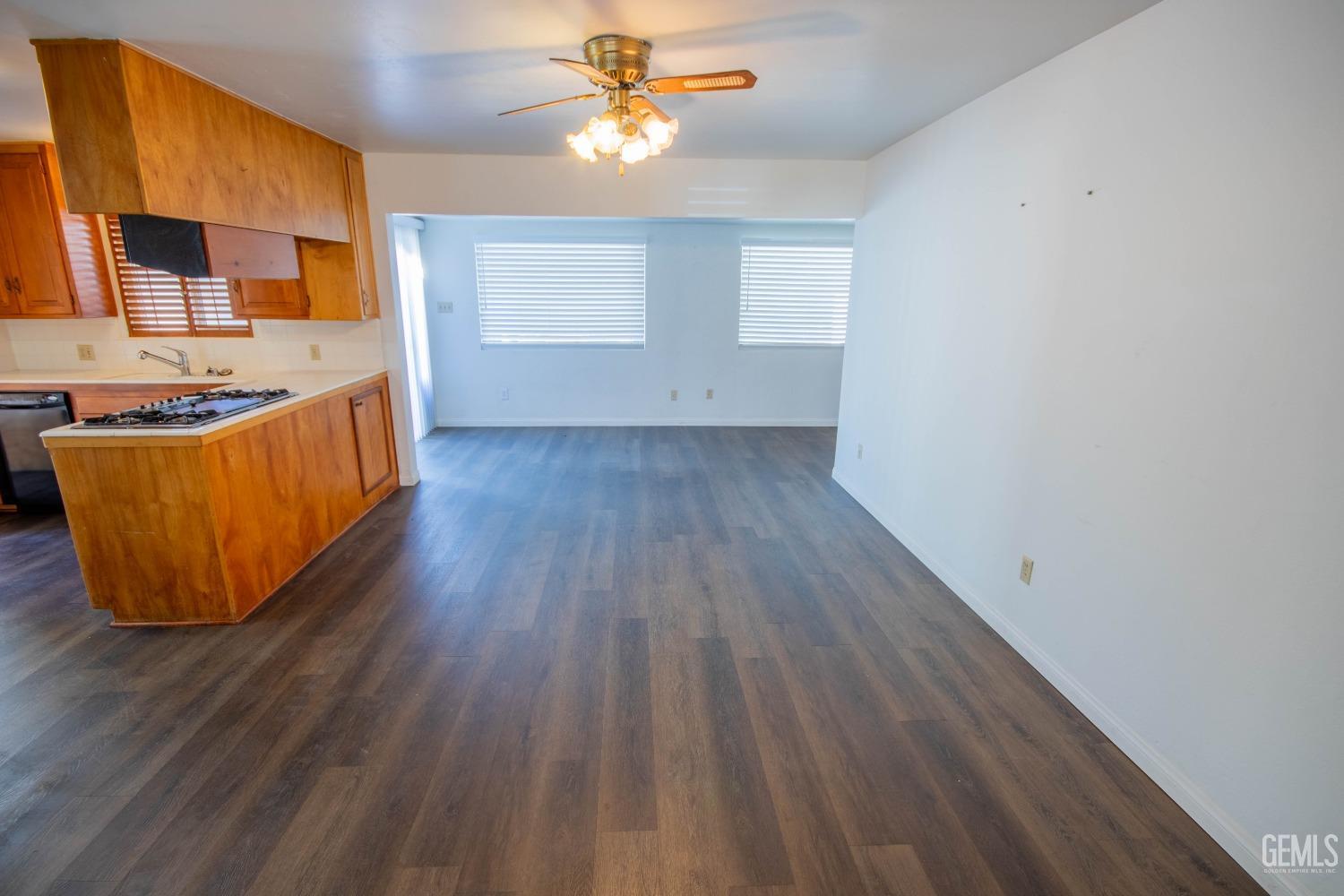 Undisclosed Address Bakersfield, CA 93309 - Photo 12 of 39 a view of a kitchen with wooden floor and a sink