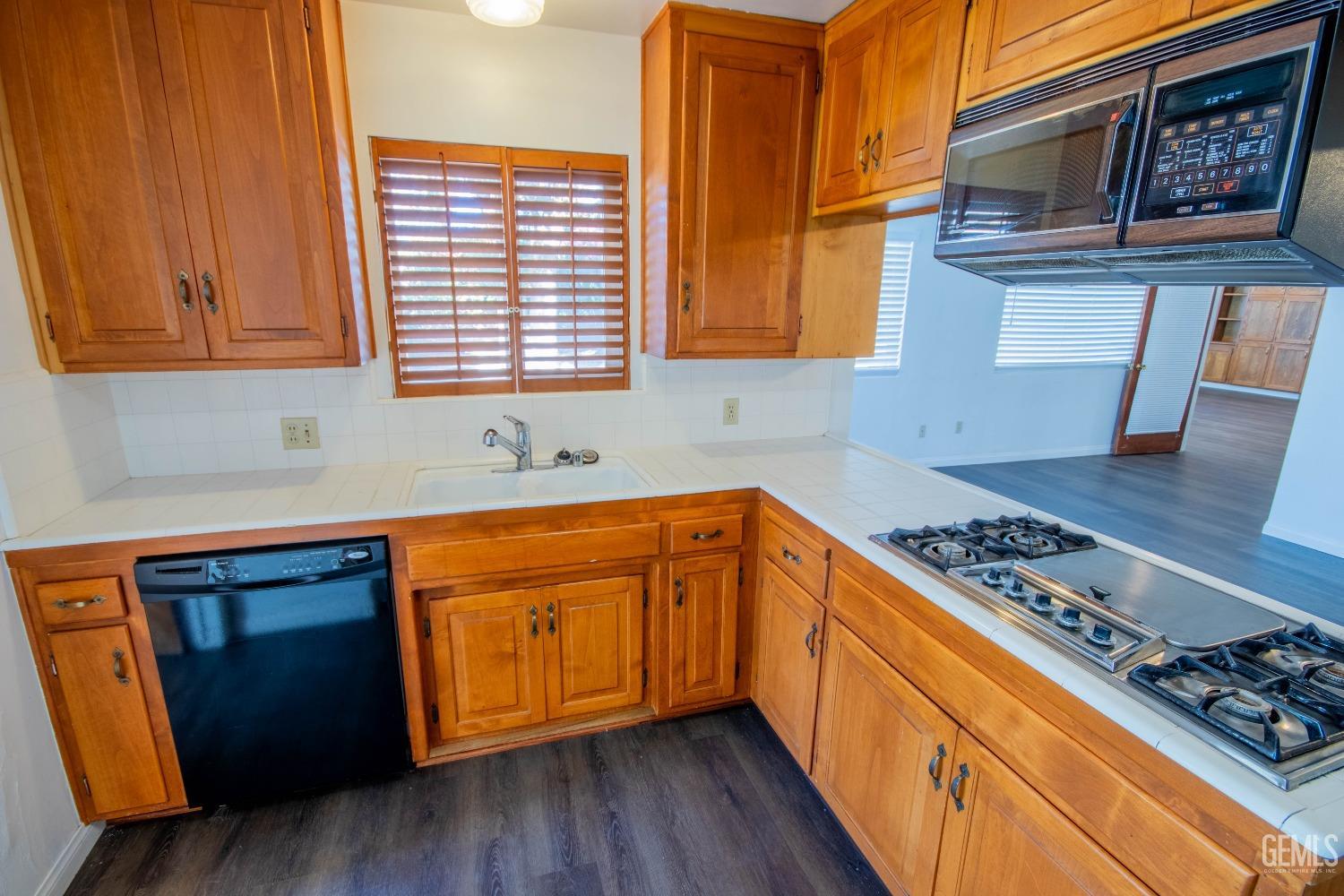 Undisclosed Address Bakersfield, CA 93309 - Photo 14 of 39 a kitchen with stainless steel appliances granite countertop a stove a sink and a cabinets