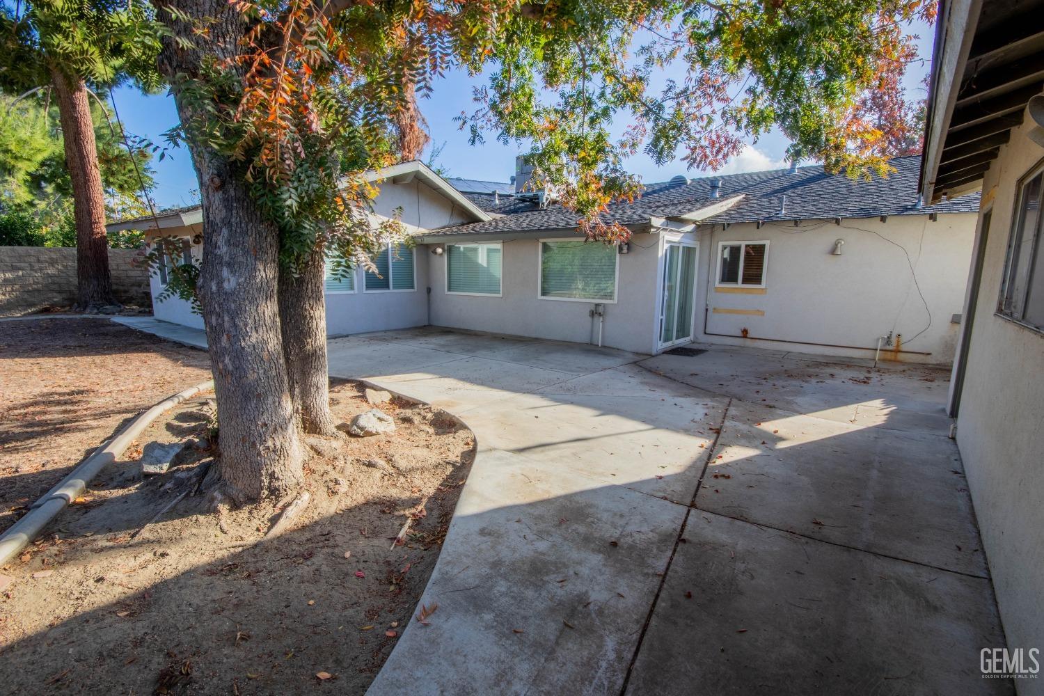 Undisclosed Address Bakersfield, CA 93309 - Photo 29 of 39 a view of a house with backyard and a tree
