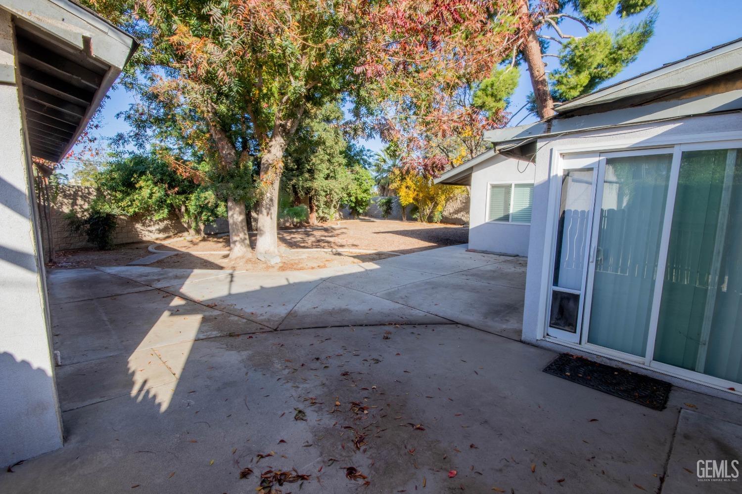 Undisclosed Address Bakersfield, CA 93309 - Photo 30 of 39 a view of a backyard with large trees