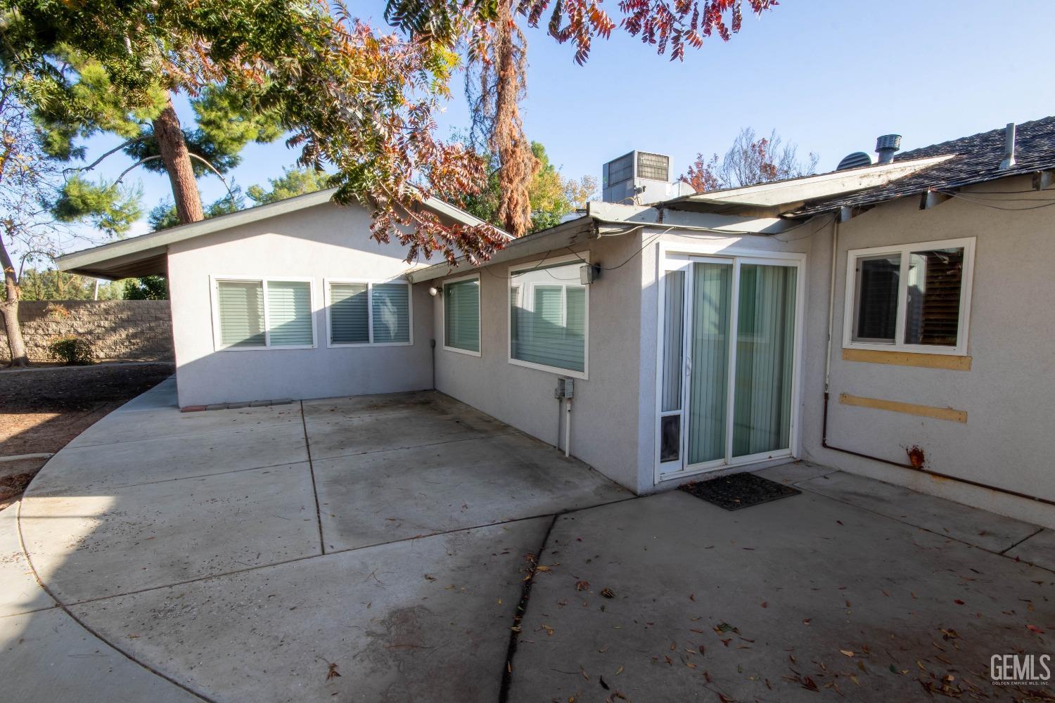 Undisclosed Address Bakersfield, CA 93309 - Photo 31 of 39 a front view of a house with a yard and garage