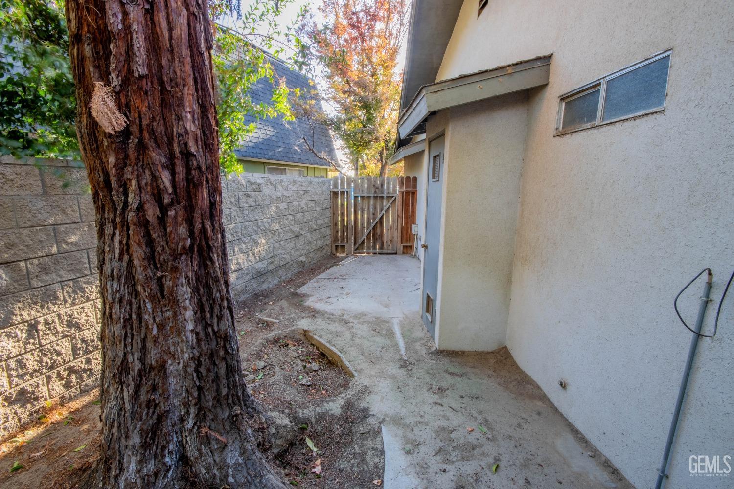 Undisclosed Address Bakersfield, CA 93309 - Photo 34 of 39 a view of a yard with a tree