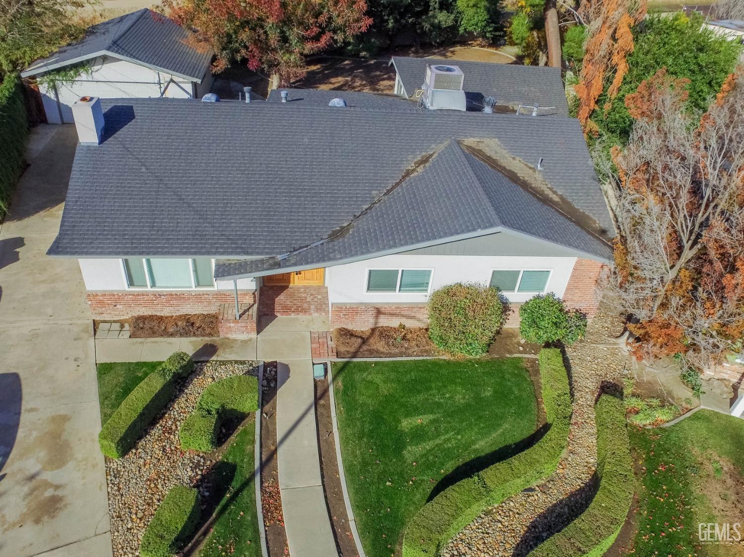 Undisclosed Address Bakersfield, CA 93309 - Photo 39 of 39 an aerial view of a house with garden space and street view