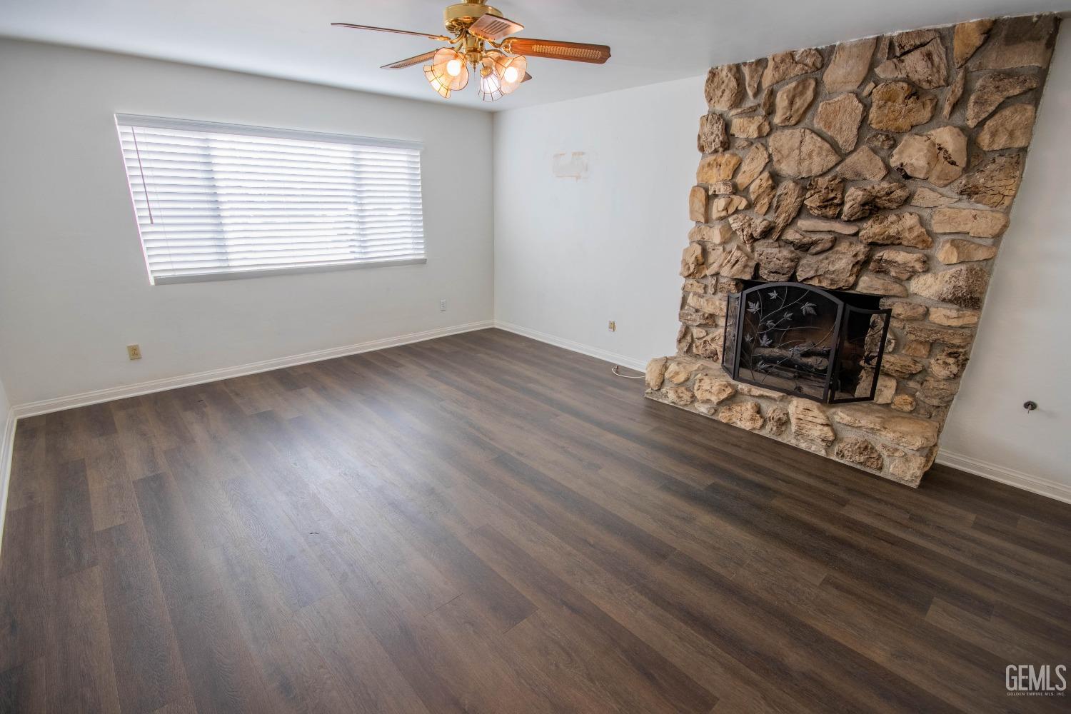 Undisclosed Address Bakersfield, CA 93309 - Photo 7 of 39 a view of a livingroom with wooden floor