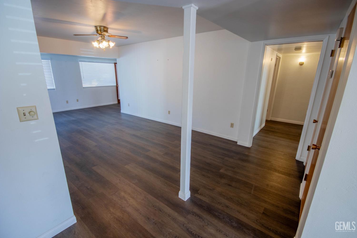 Undisclosed Address Bakersfield, CA 93309 - Photo 10 of 39 wooden floor in an empty room with a mirror