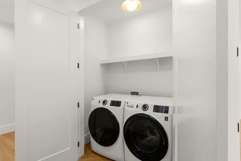 a bathroom with a tub sink and vanity