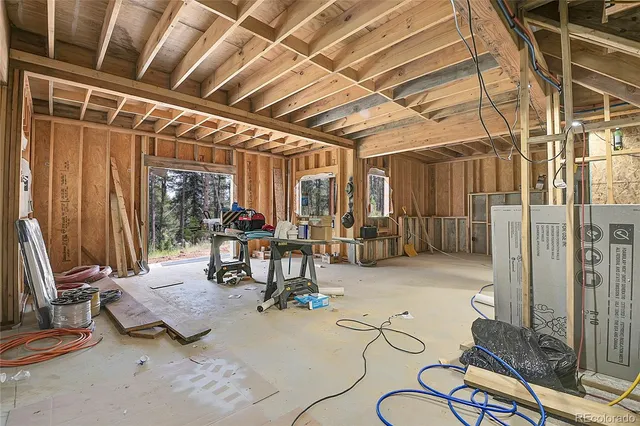 a room with lots of furniture and clutter