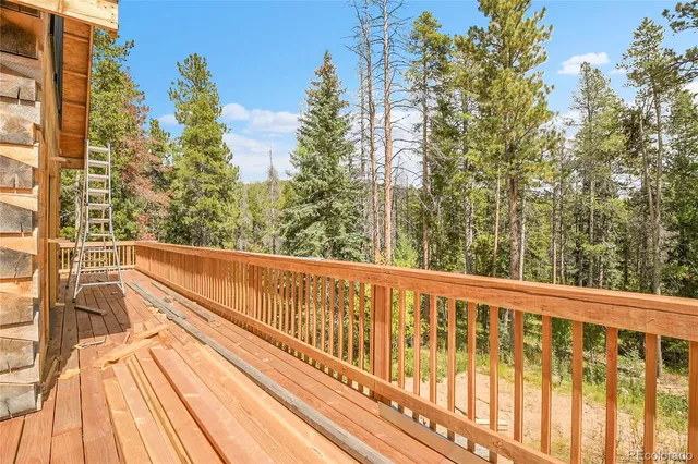 a room with lots of furniture and windows