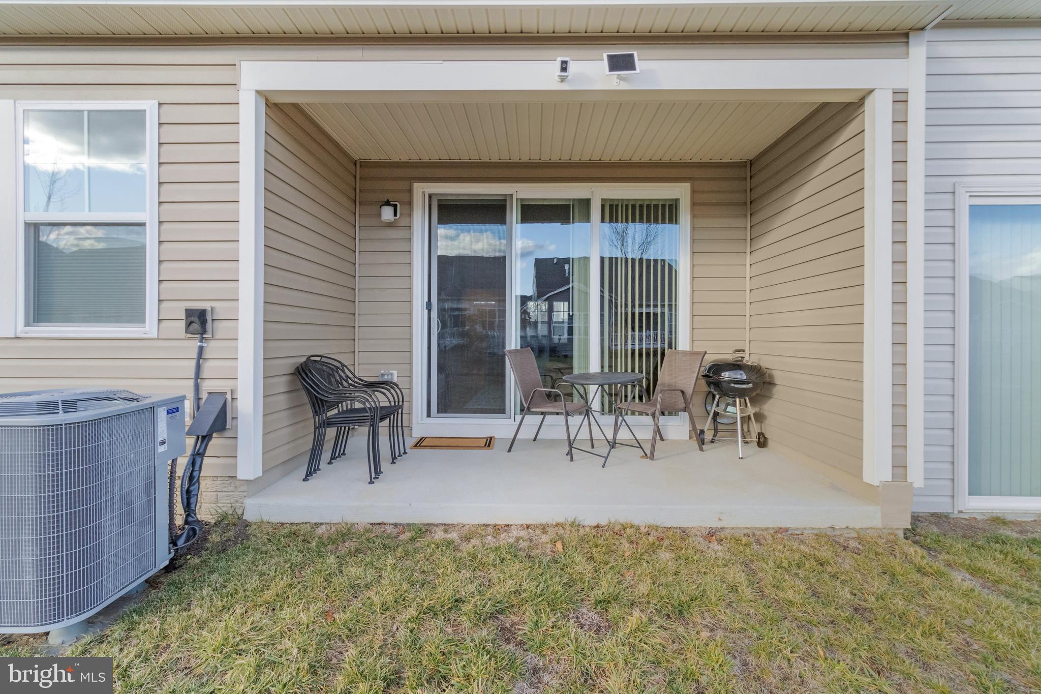 12129 American Chestnut Road Bowie, MD 20720 - Photo 23 of 25 a view of a patio with table and chairs and potted plants
