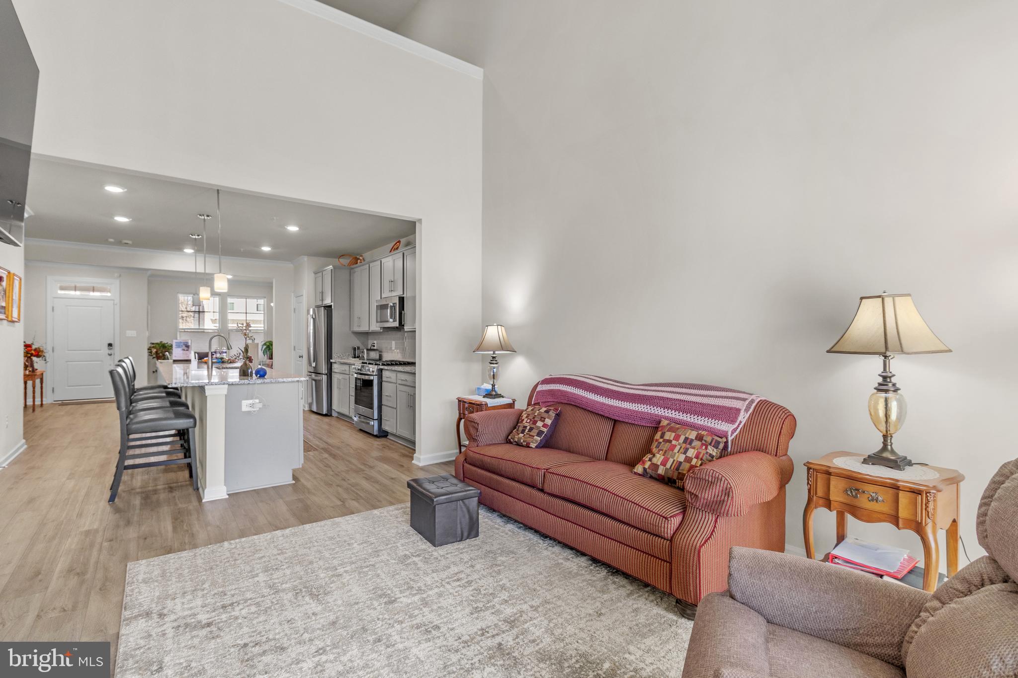 12129 American Chestnut Road Bowie, MD 20720 - Photo 10 of 25 a living room with furniture and a wooden floor