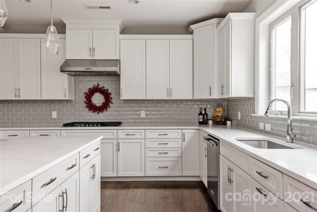 4000 Flowering Peach Road Marvin, NC 28173 - Photo 15 of 48 a kitchen with granite countertop white cabinets and white appliances