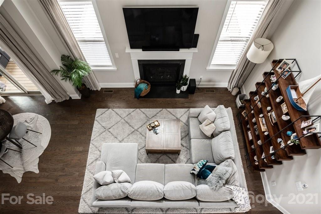 4000 Flowering Peach Road Marvin, NC 28173 - Photo 21 of 48 a living room with furniture a fireplace and a flat screen tv