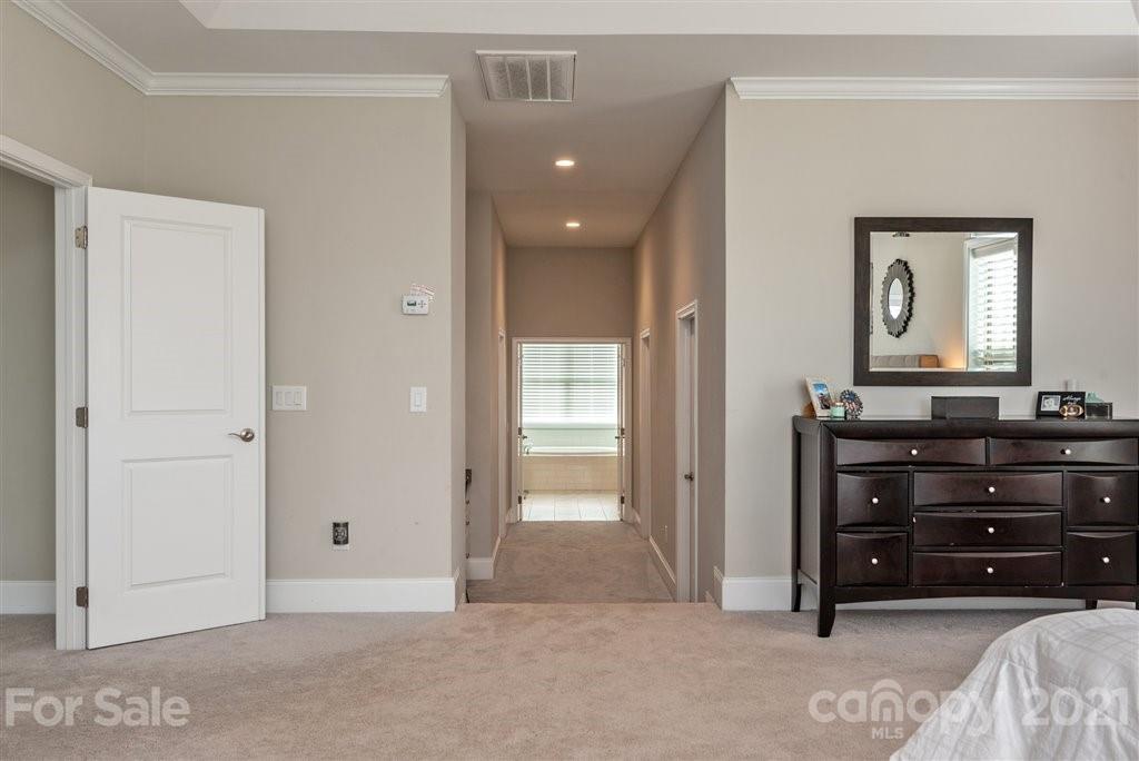 4000 Flowering Peach Road Marvin, NC 28173 - Photo 25 of 48 a view of a room with a dresser and mirror