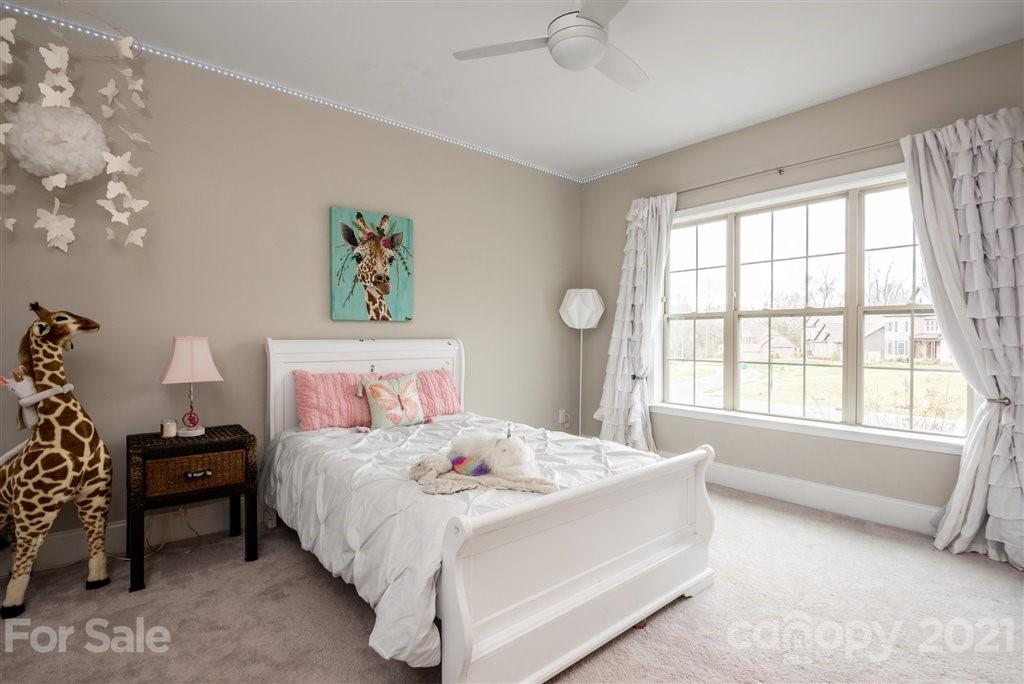 4000 Flowering Peach Road Marvin, NC 28173 - Photo 31 of 48 a bedroom with a bed and a large window