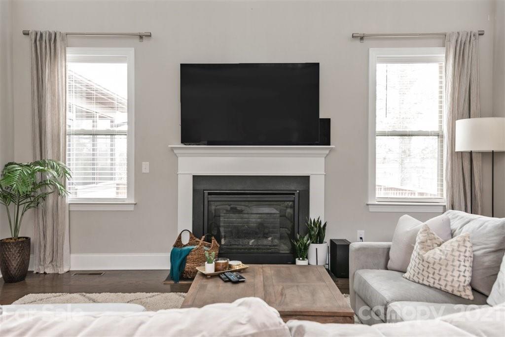 4000 Flowering Peach Road Marvin, NC 28173 - Photo 8 of 48 a living room with furniture a flat screen tv and a fireplace