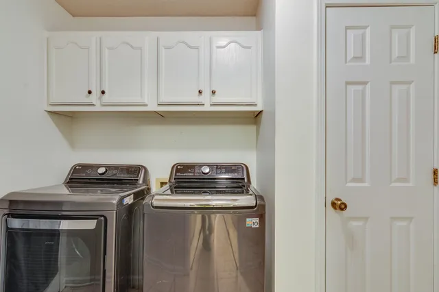 a stove top oven sitting inside of a kitchen